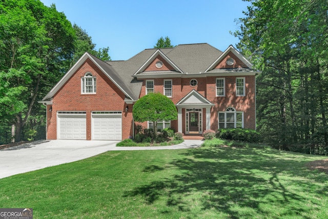 140 Longwater Cv, Roswell, GA 30075 - colonial house featuring driveway, brick siding, an attached garage, and a front lawn