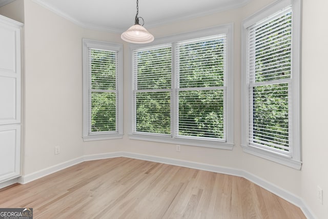 140 Longwater Cv, Roswell, GA 30075 - unfurnished dining area featuring light wood-type flooring, plenty of natural light, and crown molding