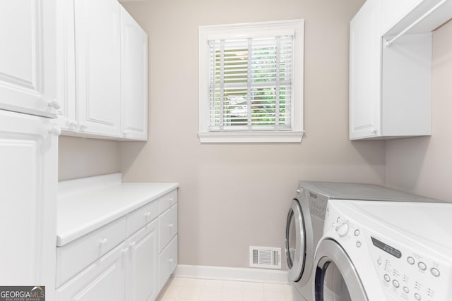 140 Longwater Cv, Roswell, GA 30075 - laundry area featuring independent washer and dryer, cabinet space, and baseboards