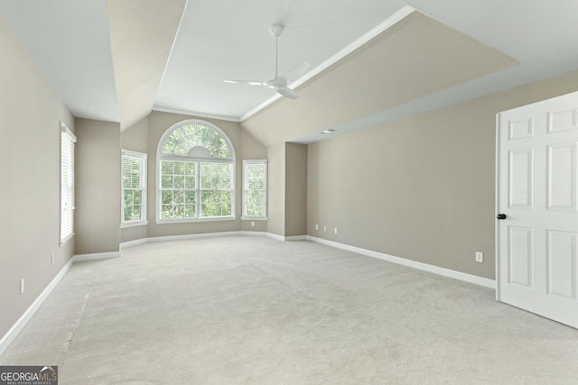 140 Longwater Cv, Roswell, GA 30075 - spare room with light carpet, ceiling fan, baseboards, and lofted ceiling