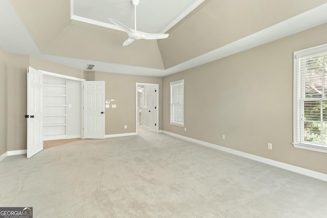 140 Longwater Cv, Roswell, GA 30075 - unfurnished bedroom featuring light colored carpet, multiple windows, baseboards, connected bathroom, and lofted ceiling