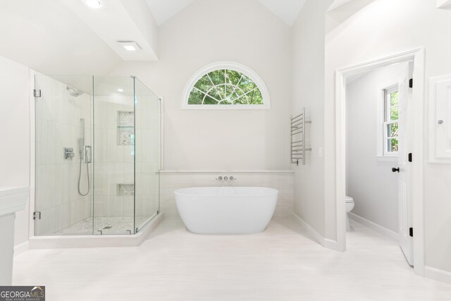 140 Longwater Cv, Roswell, GA 30075 - full bathroom with a stall shower, lofted ceiling, a soaking tub, and recessed lighting