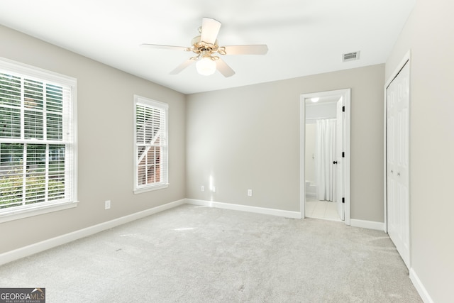 140 Longwater Cv, Roswell, GA 30075 - unfurnished bedroom with carpet floors, baseboards, connected bathroom, and a ceiling fan