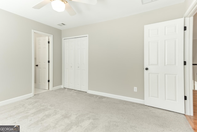 140 Longwater Cv, Roswell, GA 30075 - unfurnished bedroom featuring baseboards, a closet, carpet flooring, and a ceiling fan