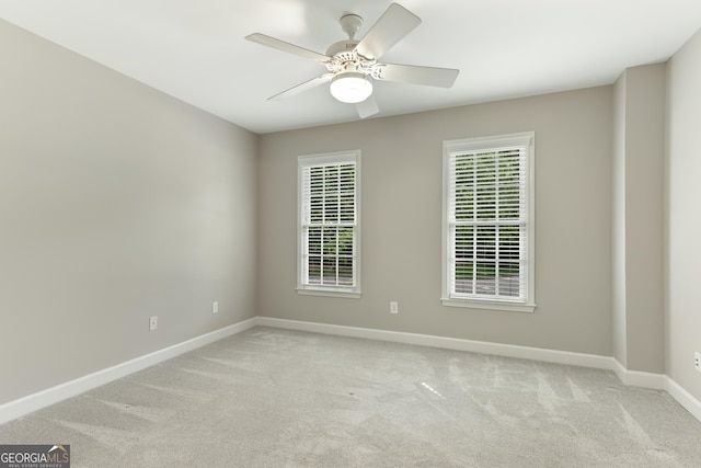 140 Longwater Cv, Roswell, GA 30075 - empty room with light colored carpet, baseboards, and a ceiling fan