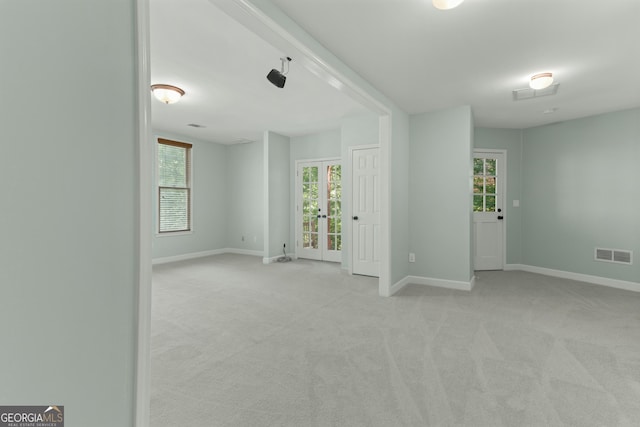 140 Longwater Cv, Roswell, GA 30075 - unfurnished room with light colored carpet, baseboards, and french doors