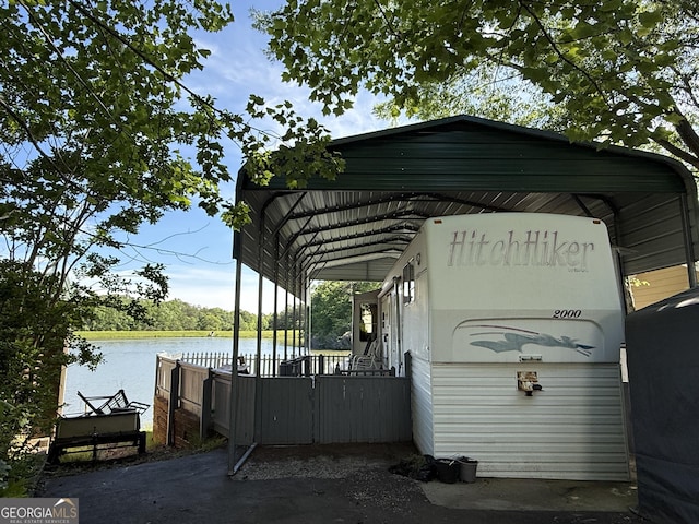 1031 Mountain Shadows Dr Unit 90A, Cleveland, GA 30528 - view of vehicle parking featuring a carport and a water view