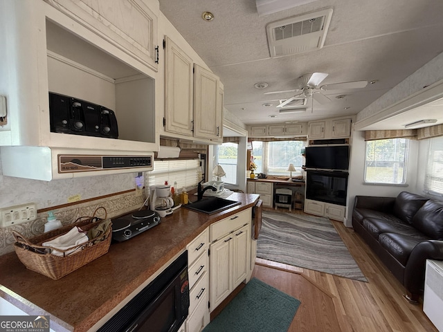 1031 Mountain Shadows Dr Unit 90A, Cleveland, GA 30528 - kitchen featuring plenty of natural light, light wood-style floors, dark countertops, and ceiling fan