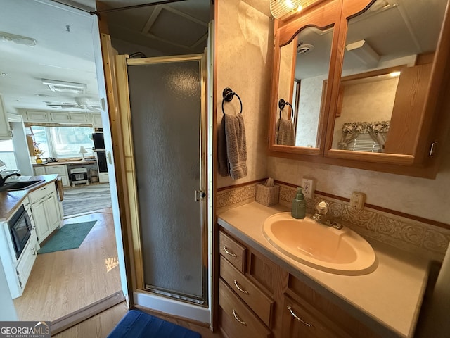 1031 Mountain Shadows Dr Unit 90A, Cleveland, GA 30528 - full bath featuring a shower stall, vanity, and wood finished floors