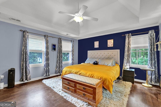 3897 Tanbark Ct, Marietta, GA 30066 - bedroom with a tray ceiling, wood finished floors, a ceiling fan, and crown molding