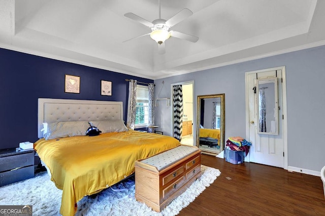 3897 Tanbark Ct, Marietta, GA 30066 - bedroom with a tray ceiling, wood finished floors, ceiling fan, and ornamental molding