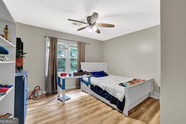 3897 Tanbark Ct, Marietta, GA 30066 - bedroom featuring light wood-style flooring and ceiling fan