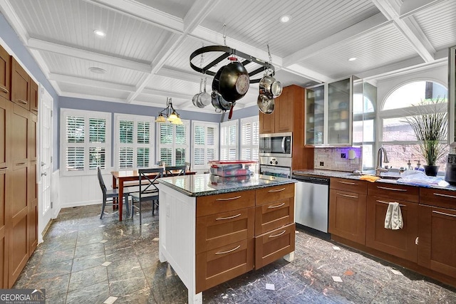 3897 Tanbark Ct, Marietta, GA 30066 - kitchen featuring appliances with stainless steel finishes, coffered ceiling, beamed ceiling, glass insert cabinets, and healthy amount of natural light