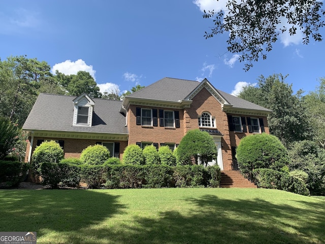 30 Highlands Ln, Oxford, GA 30054 - colonial house featuring brick siding, a front lawn, and a shingled roof