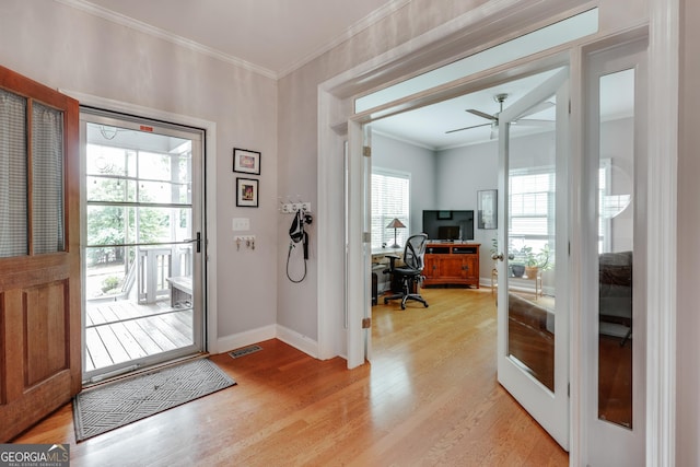 1860 Old W Broad St, Athens, GA 30606 - entryway featuring light wood-type flooring, baseboards, healthy amount of natural light, and ornamental molding