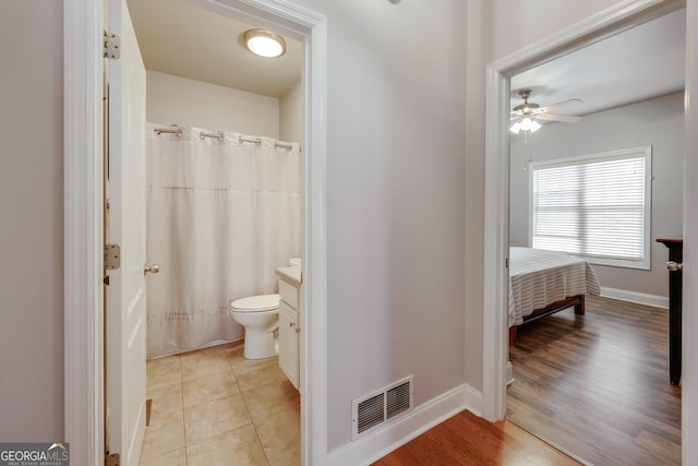1860 Old W Broad St, Athens, GA 30606 - full bath with toilet, vanity, ceiling fan, and baseboards