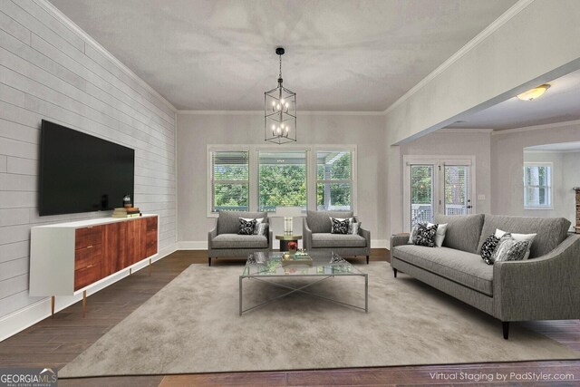 1231 Fawndale Dr NW, Kennesaw, GA 30152 - living area featuring wood finished floors, healthy amount of natural light, ornamental molding, and a chandelier
