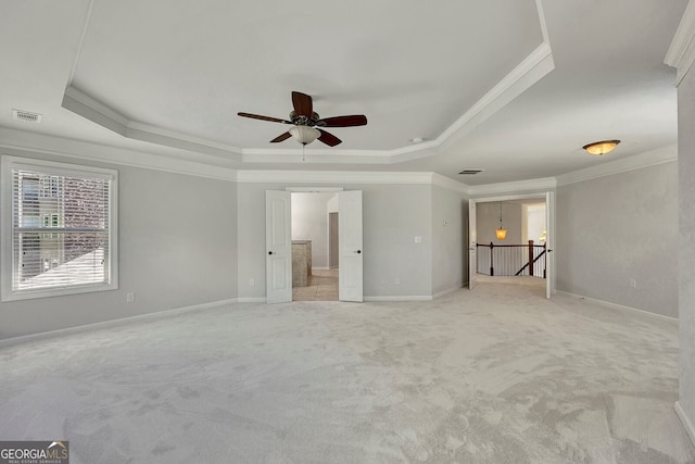 1231 Fawndale Dr NW, Kennesaw, GA 30152 - unfurnished living room with a raised ceiling, ornamental molding, light carpet, and a ceiling fan