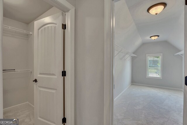 1231 Fawndale Dr NW, Kennesaw, GA 30152 - spacious closet featuring vaulted ceiling and light carpet
