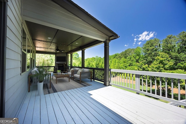 1231 Fawndale Dr NW, Kennesaw, GA 30152 - wooden terrace featuring a ceiling fan and an outdoor living space with a fireplace