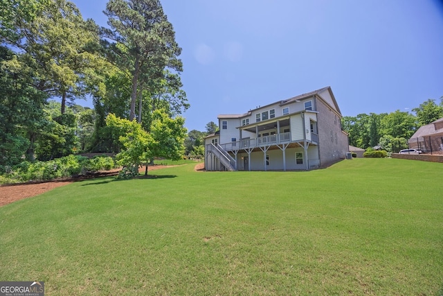 1231 Fawndale Dr NW, Kennesaw, GA 30152 - back of house featuring a lawn