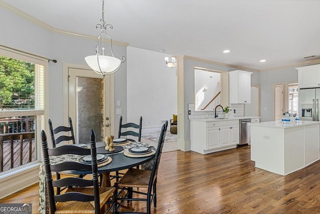 1500 Royce Dr, Locust Grove, GA 30248 - dining space featuring crown molding, dark wood-style floors, recessed lighting, and stairway