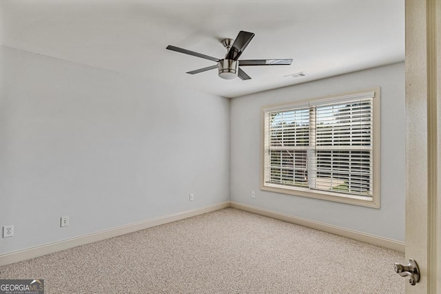1500 Royce Dr, Locust Grove, GA 30248 - spare room featuring carpet flooring, baseboards, and ceiling fan