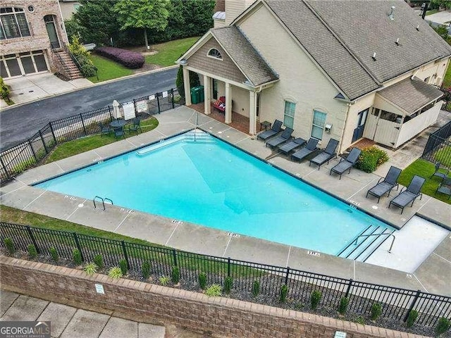 3386 Vintage Cir SE Unit 8, Smyrna, GA 30080 - community pool featuring a patio