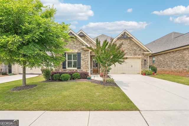 332 Rosshandler Rd, Suwanee, GA 30024 - craftsman-style home featuring concrete driveway, an attached garage, brick siding, and a front yard