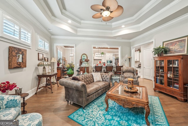 332 Rosshandler Rd, Suwanee, GA 30024 - living area with ceiling fan, light wood-type flooring, a raised ceiling, and crown molding