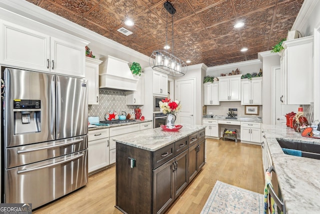 332 Rosshandler Rd, Suwanee, GA 30024 - kitchen with stainless steel appliances, an ornate ceiling, white cabinetry, custom range hood, and tasteful backsplash