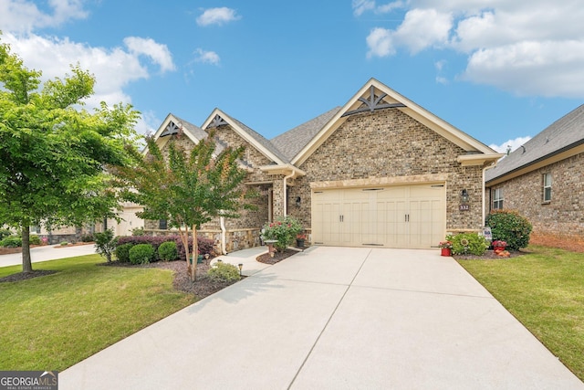 332 Rosshandler Rd, Suwanee, GA 30024 - craftsman house featuring a front yard, a garage, concrete driveway, and brick siding