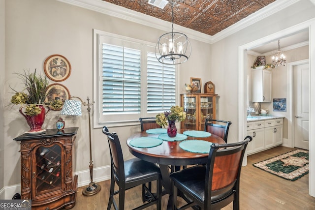 332 Rosshandler Rd, Suwanee, GA 30024 - dining area with a chandelier, light wood-type flooring, and an ornate ceiling