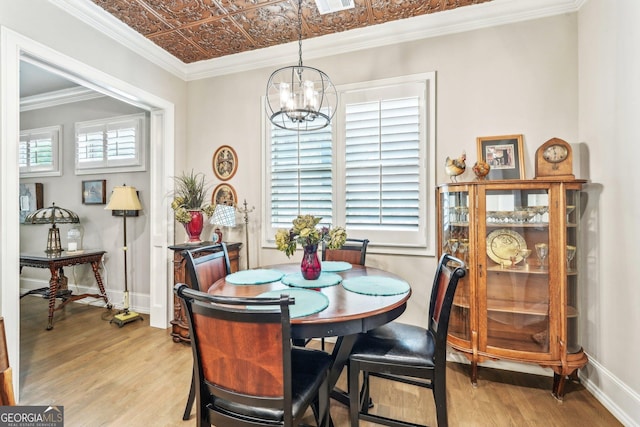 332 Rosshandler Rd, Suwanee, GA 30024 - dining area with light wood-style floors, a chandelier, an ornate ceiling, and baseboards