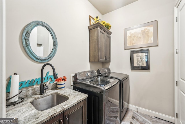 332 Rosshandler Rd, Suwanee, GA 30024 - washroom featuring cabinet space, separate washer and dryer, and baseboards