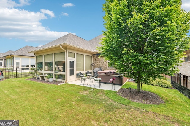 332 Rosshandler Rd, Suwanee, GA 30024 - back of house featuring a hot tub, a patio area, a sunroom, and roof with shingles