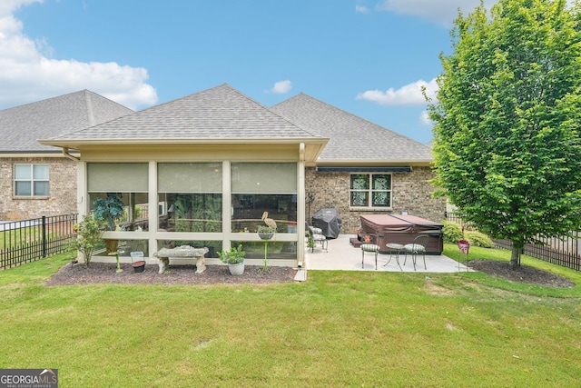 332 Rosshandler Rd, Suwanee, GA 30024 - back of house with a hot tub, a patio, a shingled roof, a sunroom, and brick siding