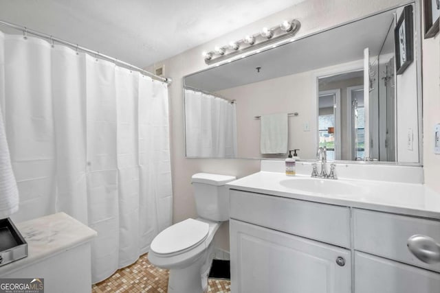 375 Ralph Mcgill Blvd NE Unit 707, Atlanta, GA 30312 - bathroom featuring vanity, toilet, and a shower with shower curtain