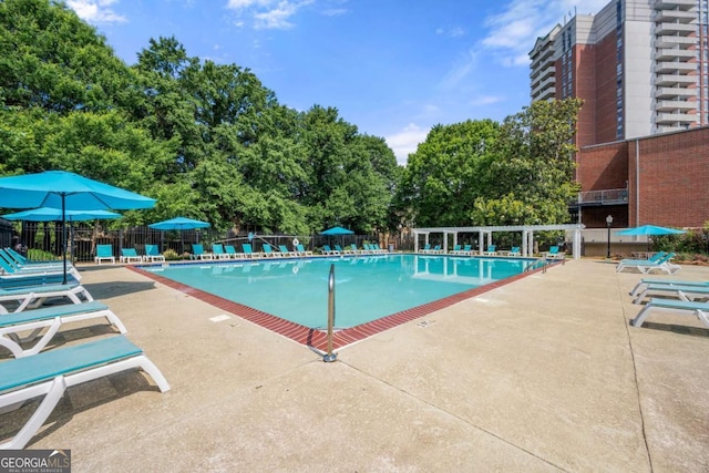 375 Ralph Mcgill Blvd NE Unit 707, Atlanta, GA 30312 - community pool featuring a patio and view of scattered trees