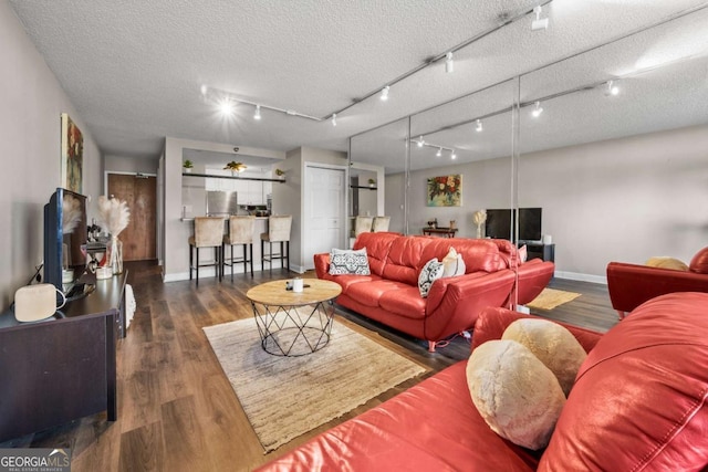 375 Ralph Mcgill Blvd NE Unit 707, Atlanta, GA 30312 - living room featuring baseboards, wood finished floors, and a textured ceiling