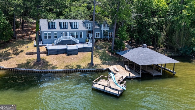 230 Kelly Dr, Hamilton, GA 31811 - dock featuring stairway, boat lift, a deck with water view, and a lawn