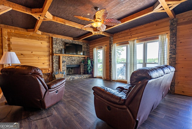 230 Kelly Dr, Hamilton, GA 31811 - living area featuring wooden walls, wood ceiling with exposed beams, wood finished floors, a ceiling fan, and a fireplace