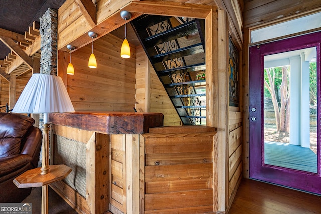 230 Kelly Dr, Hamilton, GA 31811 - staircase featuring wooden walls and wood finished floors