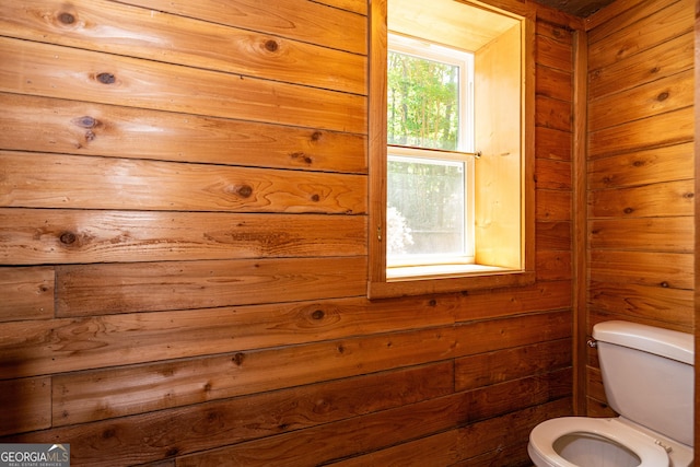 230 Kelly Dr, Hamilton, GA 31811 - bathroom featuring toilet and wood walls