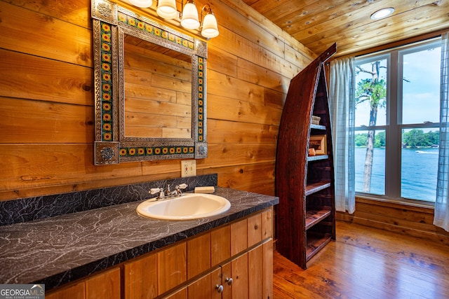 230 Kelly Dr, Hamilton, GA 31811 - bathroom featuring vanity, wood walls, hardwood / wood-style floors, and wooden ceiling