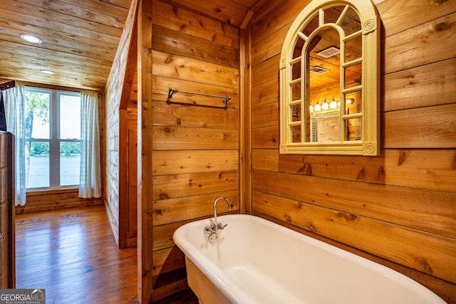 230 Kelly Dr, Hamilton, GA 31811 - bathroom with a freestanding tub, wooden walls, wood finished floors, and wooden ceiling