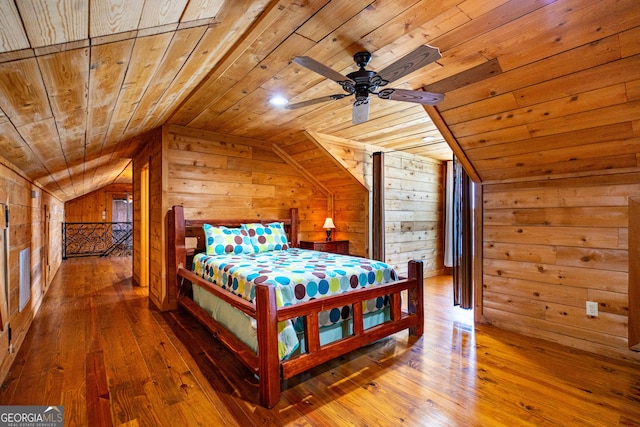 230 Kelly Dr, Hamilton, GA 31811 - bedroom with wood ceiling, wooden walls, vaulted ceiling, and hardwood / wood-style flooring