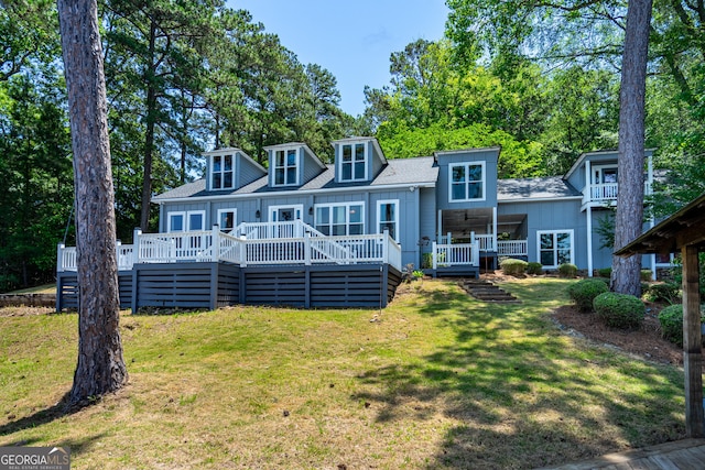 230 Kelly Dr, Hamilton, GA 31811 - back of house with a yard, a wooden deck, and roof with shingles