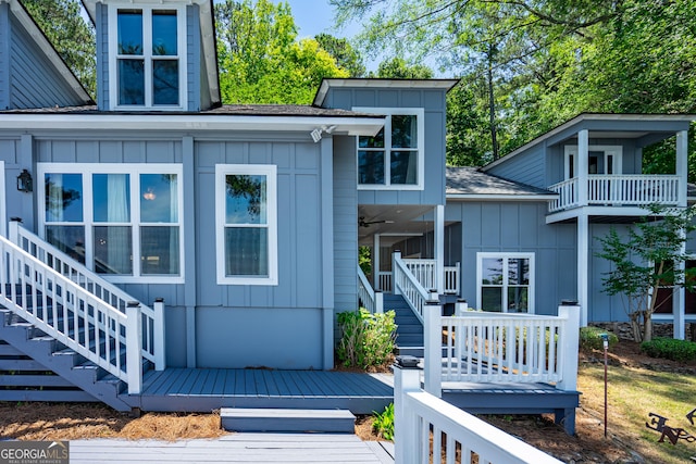 230 Kelly Dr, Hamilton, GA 31811 - doorway to property featuring board and batten siding, a shingled roof, a wooden deck, and ceiling fan