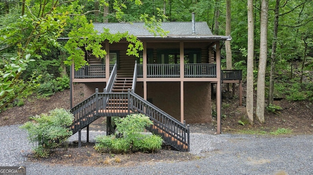 853 Bates Rd, Ellijay, GA 30540 - view of front facade featuring stairway, log exterior, roof with shingles, and a porch